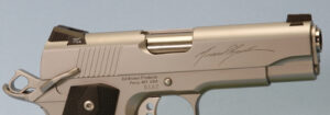 Ayoob's signature is laser-engraved on the slide.