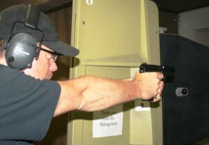The author sends rounds downrange with the TP-9