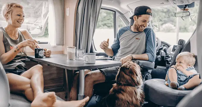 Family With Pet In Van