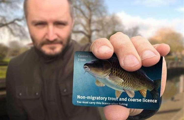 Man Holding Fishing Licence