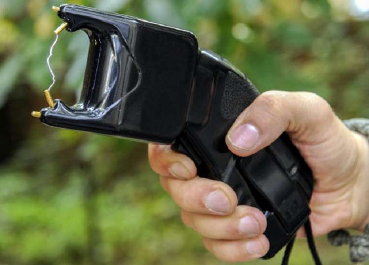 Holding a Stun Gun