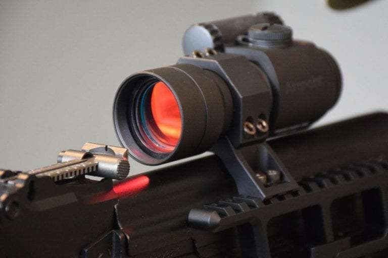 Red dot sight mounted on a rifle