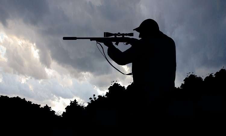 Man Holding Rifle