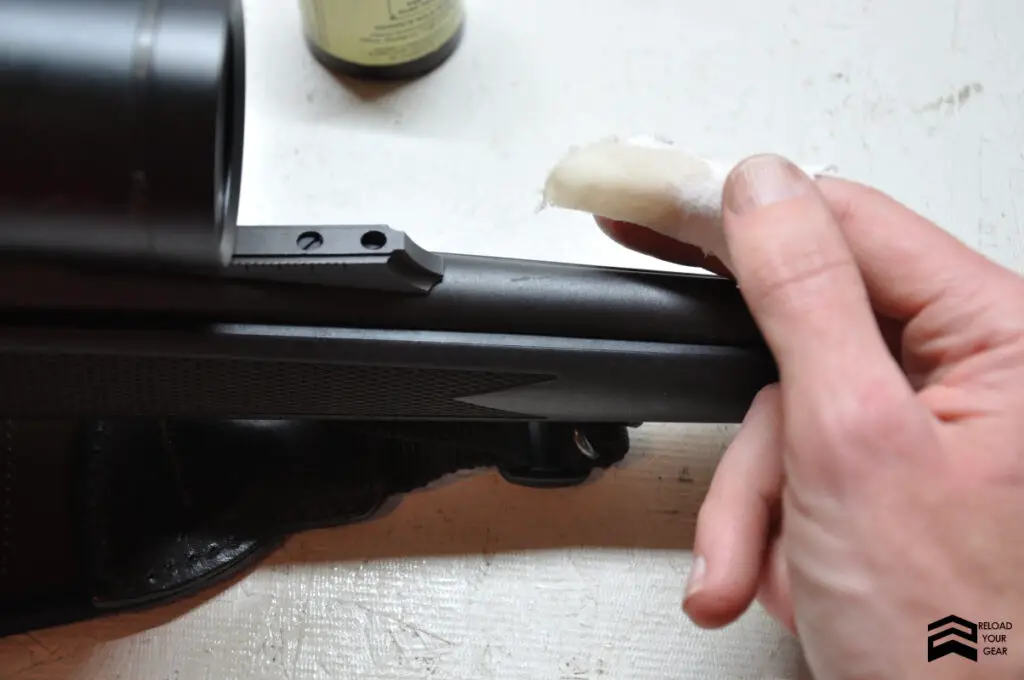 applying oil to rifle barrel