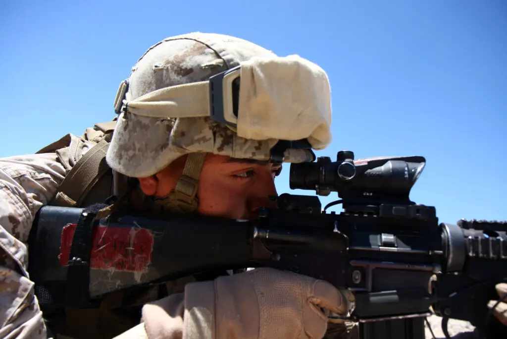 Soldier looking through ACOG